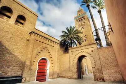 The Koutoubia Minaret and a city gate in Marrakech
