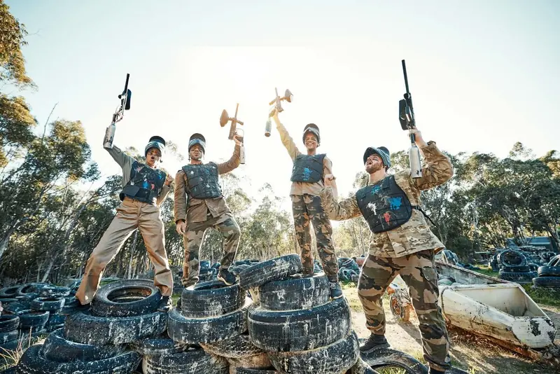 A team in full gear on a paintball field